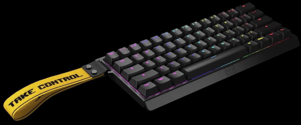 Wooting 60HE+ black keyboard with its yellow Take Control strap